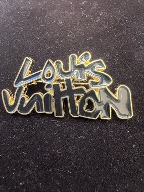 Brooch, graffiti